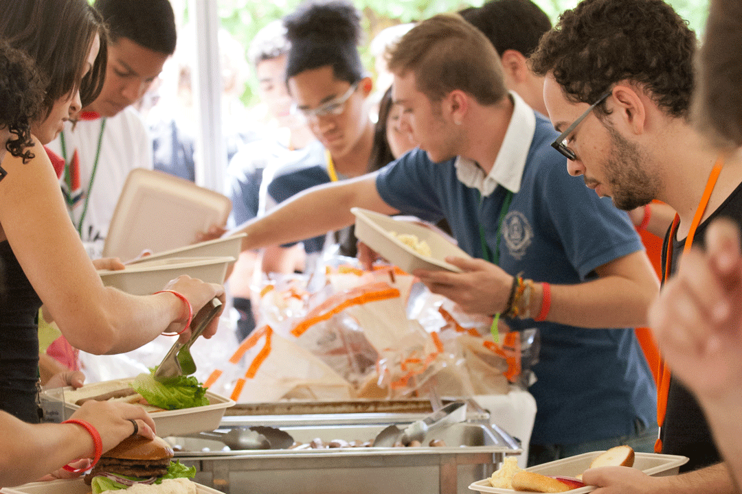 Pre-College students in a line for food