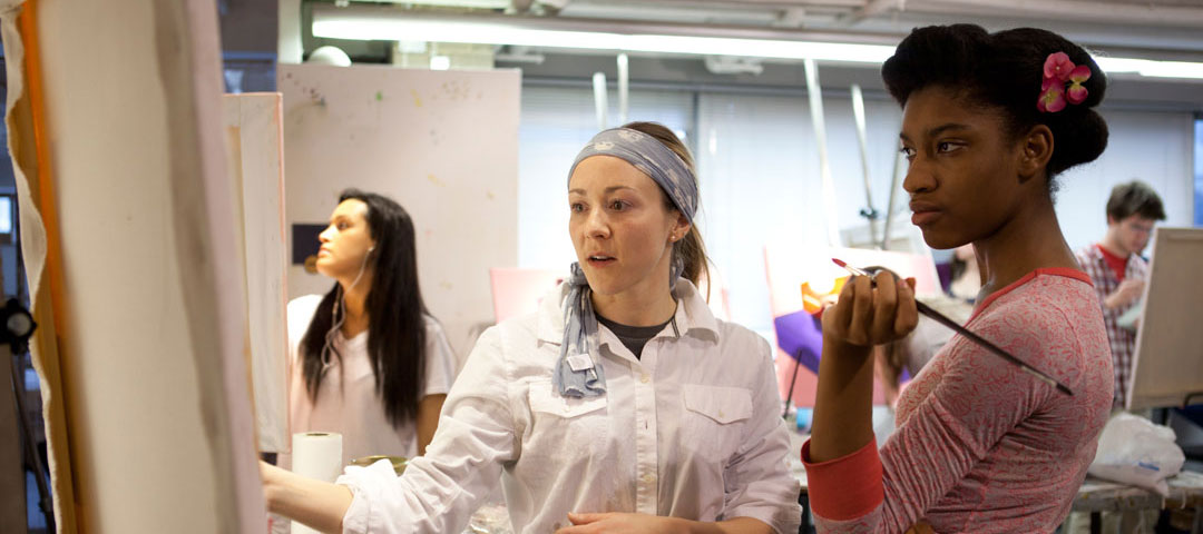 A Pre-College student in a painting class